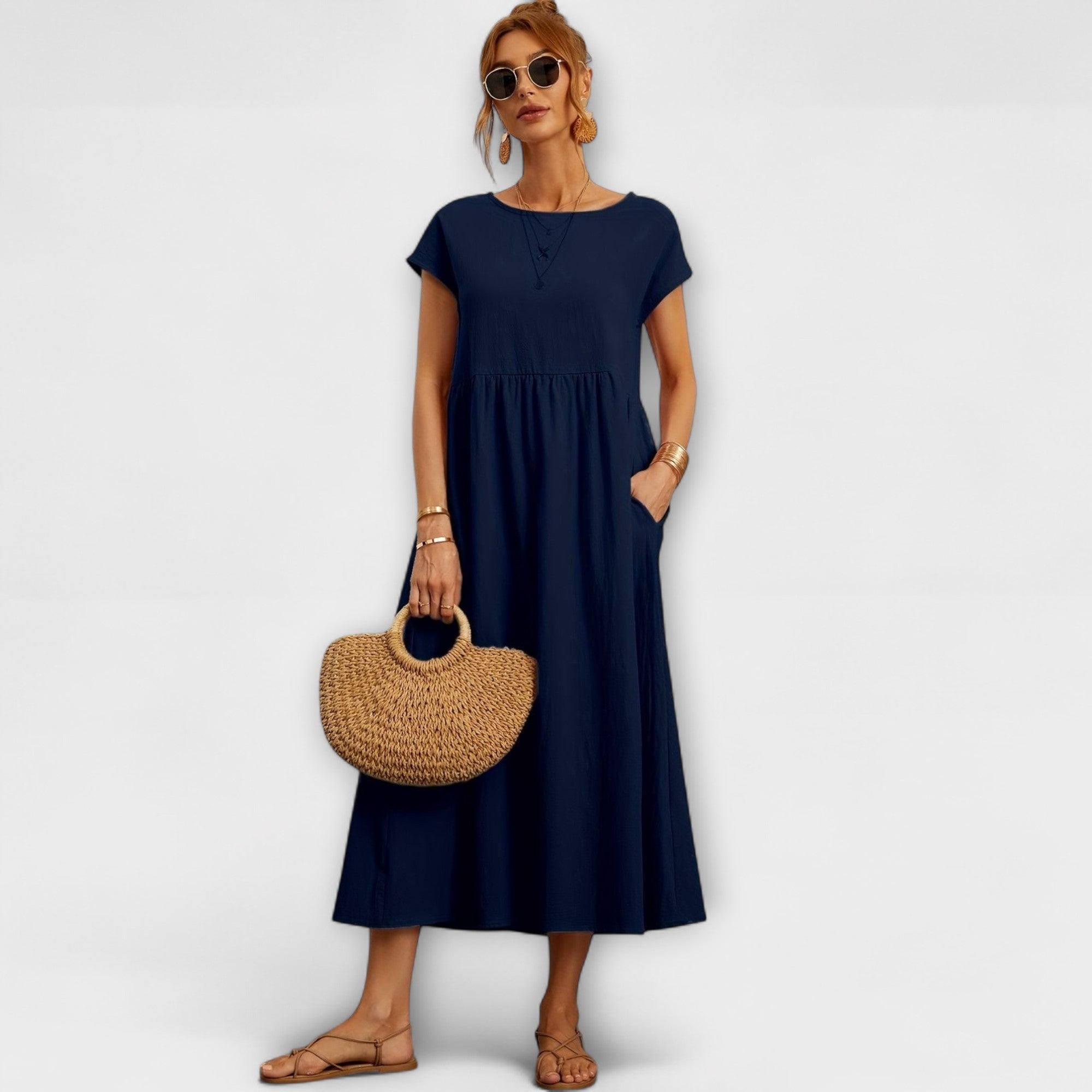 Robe midi à la ligne simple et poches latérales
