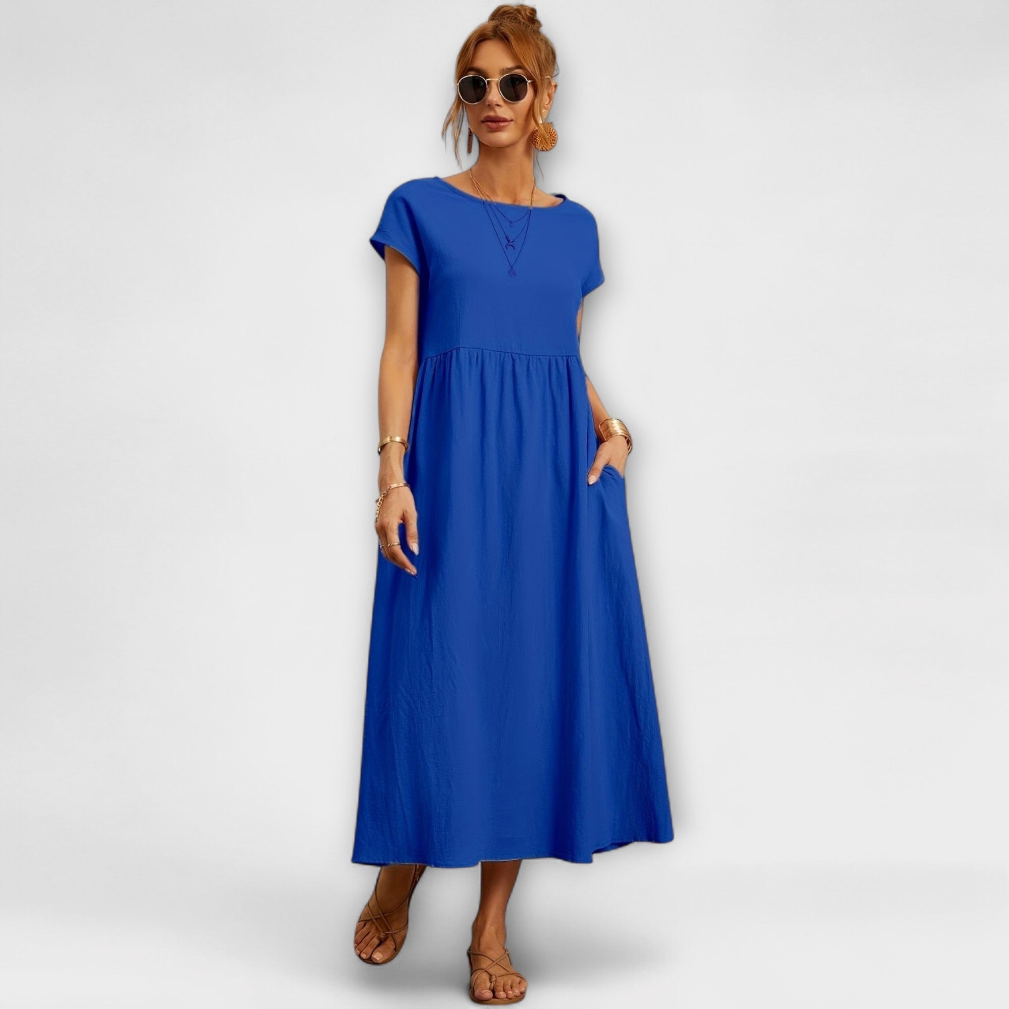 Robe midi à la ligne simple et poches latérales