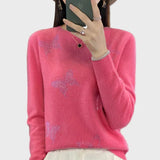 Col roulé tricoté à motif papillon