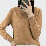 Col roulé tricoté à motif papillon